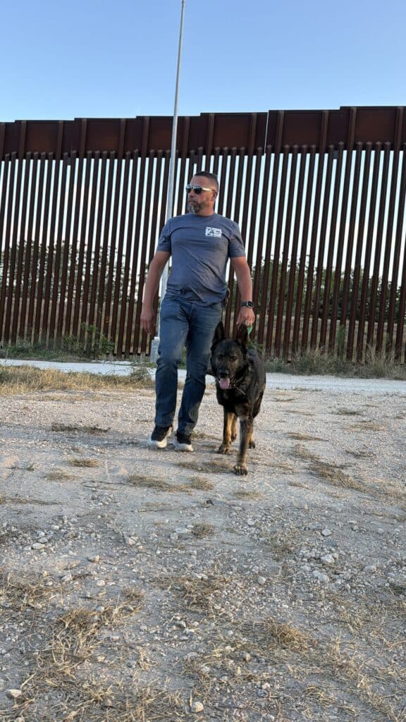 Executive with protection dog